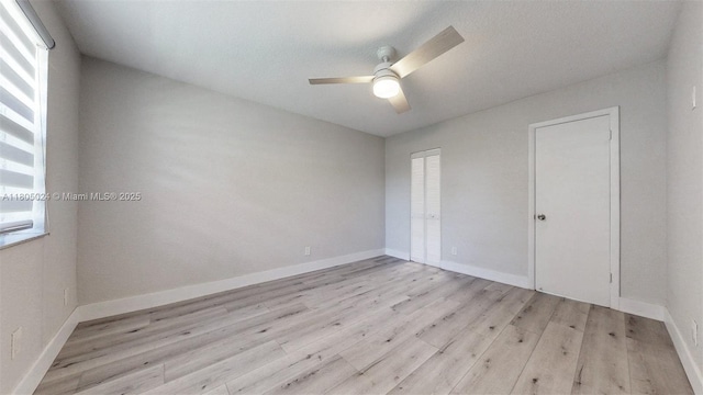 15805 W Waterside Cir Unit 202, Sunrise, FL 33326 - unfurnished bedroom with light wood-style flooring, ceiling fan, and baseboards