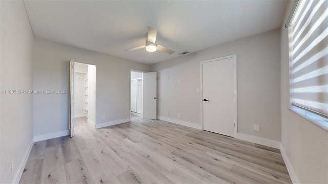 15805 W Waterside Cir Unit 202, Sunrise, FL 33326 - unfurnished bedroom with light wood-style floors, baseboards, a ceiling fan, and ensuite bathroom