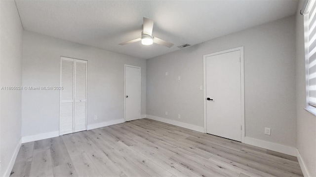15805 W Waterside Cir Unit 202, Sunrise, FL 33326 - unfurnished bedroom featuring light wood finished floors, baseboards, a ceiling fan, and a closet