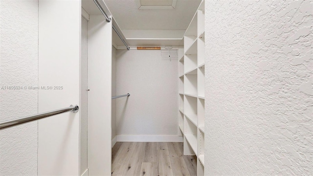 15805 W Waterside Cir Unit 202, Sunrise, FL 33326 - walk in closet featuring light wood-style flooring