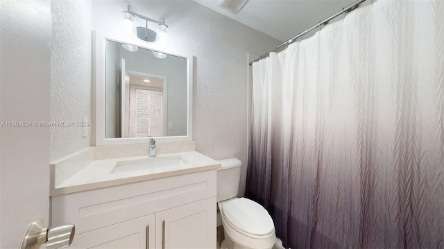 15805 W Waterside Cir Unit 202, Sunrise, FL 33326 - bathroom with a textured wall, toilet, vanity, and a shower with curtain
