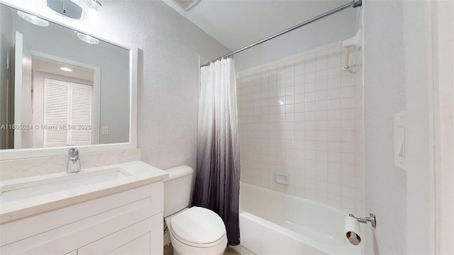 15805 W Waterside Cir Unit 202, Sunrise, FL 33326 - bathroom featuring toilet, shower / tub combo with curtain, vanity, and a textured wall