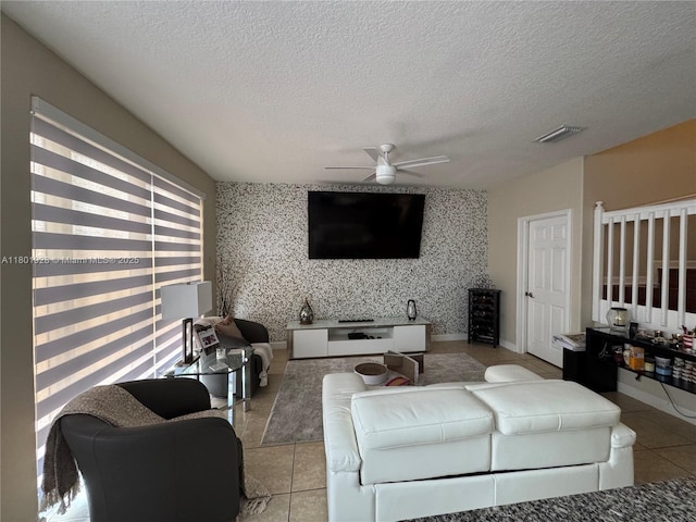 4892 NW 109th Pl, Doral, FL 33178 - living area with ceiling fan, light tile patterned floors, wallpapered walls, a textured ceiling, and baseboards