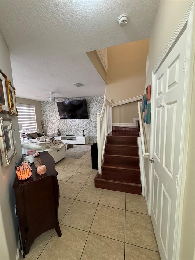 4892 NW 109th Pl, Doral, FL 33178 - stairs featuring a textured ceiling, tile patterned flooring, and a ceiling fan