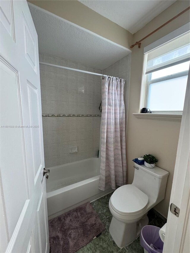 4892 NW 109th Pl, Doral, FL 33178 - full bathroom featuring toilet and shower / bathtub combination with curtain