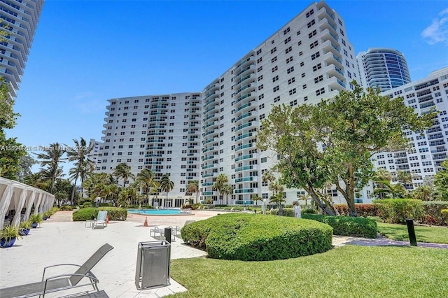 3001 S Ocean Dr Unit 321, Hollywood, FL 33019 - view of building exterior featuring a community pool and a city view