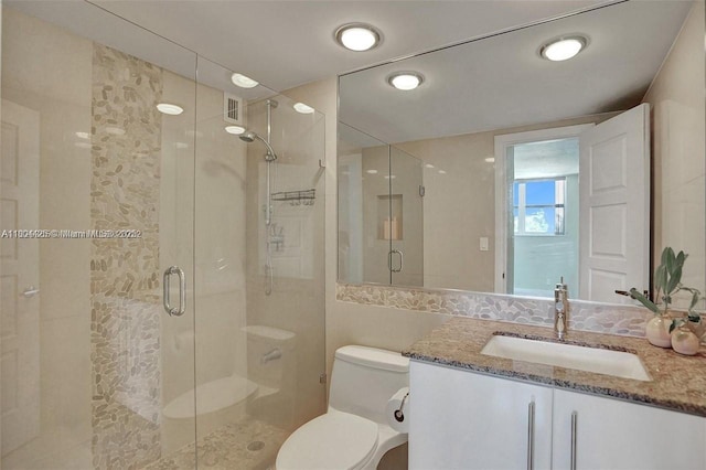 3001 S Ocean Dr Unit 321, Hollywood, FL 33019 - bathroom with toilet, a shower stall, and vanity