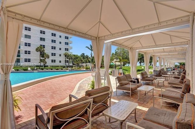 3001 S Ocean Dr Unit 321, Hollywood, FL 33019 - community pool featuring a patio, a gazebo, and outdoor lounge area