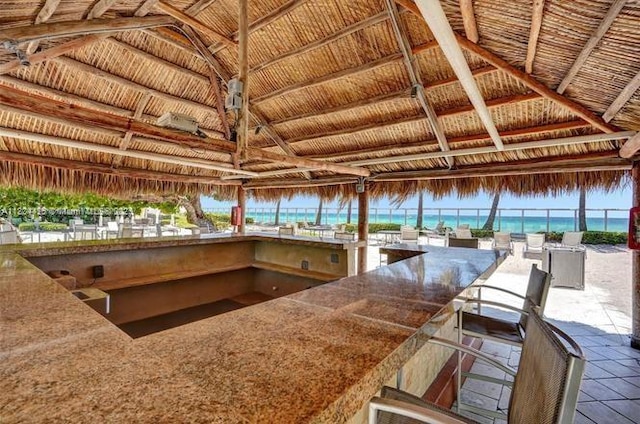 3001 S Ocean Dr Unit 321, Hollywood, FL 33019 - view of patio with a gazebo, view of water and beach, a bar, and fence