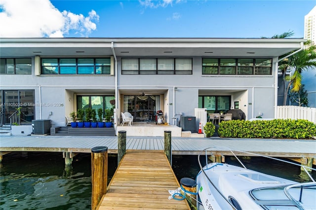 214 Poinciana Dr Unit 204, Sunny Isles Beach, FL 33160 - back of property with stucco siding and central AC unit