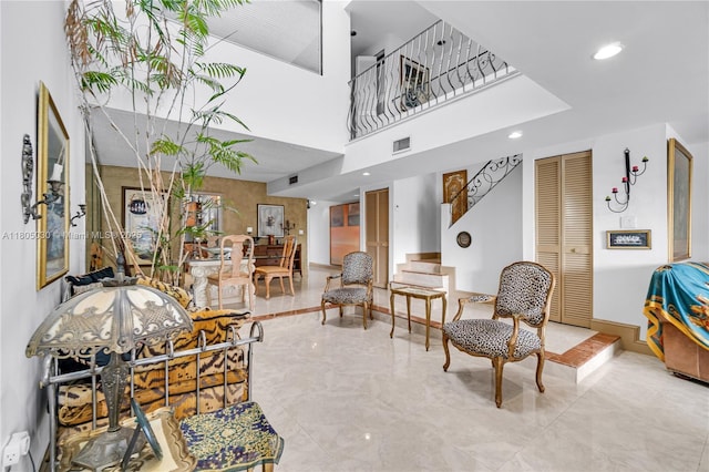 214 Poinciana Dr Unit 204, Sunny Isles Beach, FL 33160 - interior space featuring a high ceiling, stairway, and recessed lighting