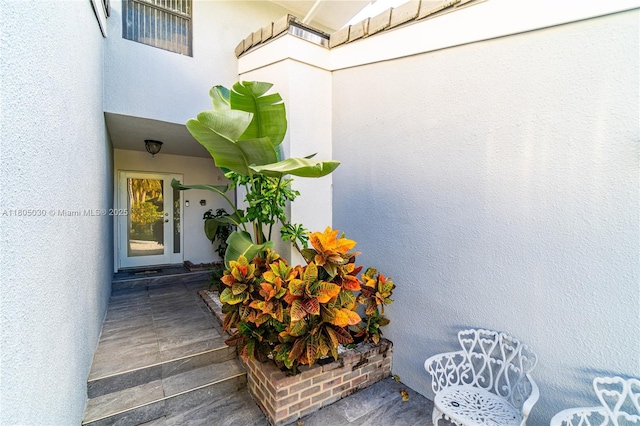 214 Poinciana Dr Unit 204, Sunny Isles Beach, FL 33160 - view of exterior entry featuring stucco siding