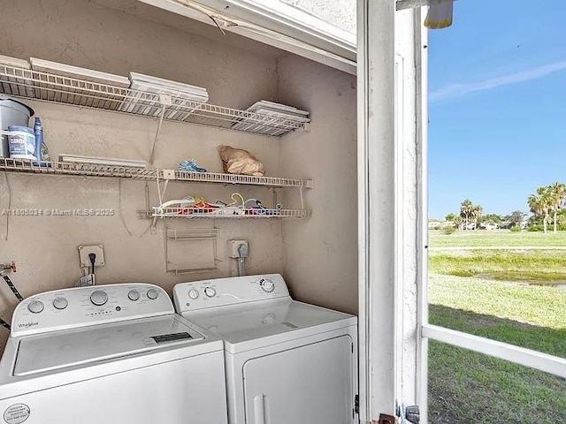 washroom with washer and clothes dryer