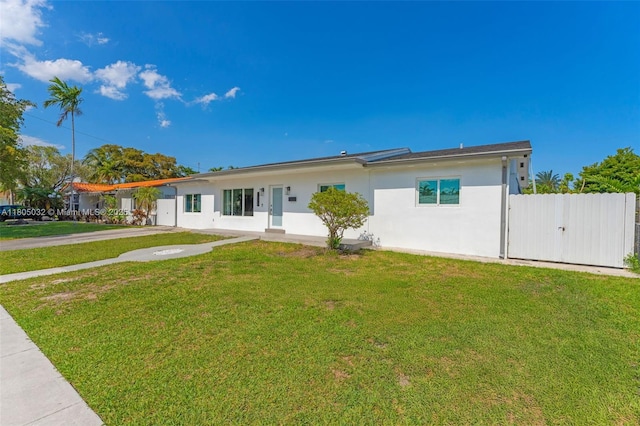2023 SW 99th Ave, Miami, FL 33165 - view of front of property featuring stucco siding and a front lawn