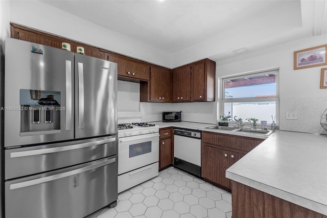 2023 SW 99th Ave, Miami, FL 33165 - kitchen featuring white appliances, a sink, light countertops, and light tile patterned floors