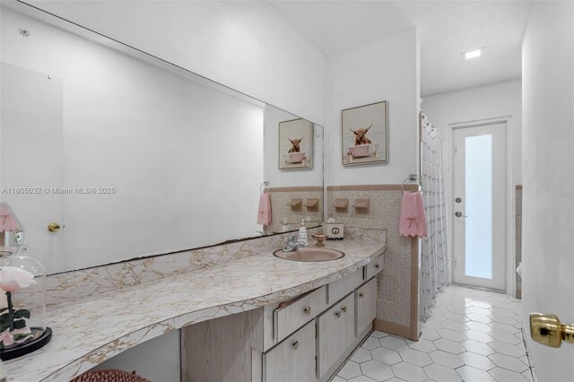 2023 SW 99th Ave, Miami, FL 33165 - full bath with vanity, tile walls, tile patterned floors, and wainscoting