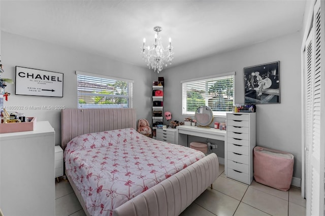 2023 SW 99th Ave, Miami, FL 33165 - bedroom with multiple windows, light tile patterned floors, and a chandelier