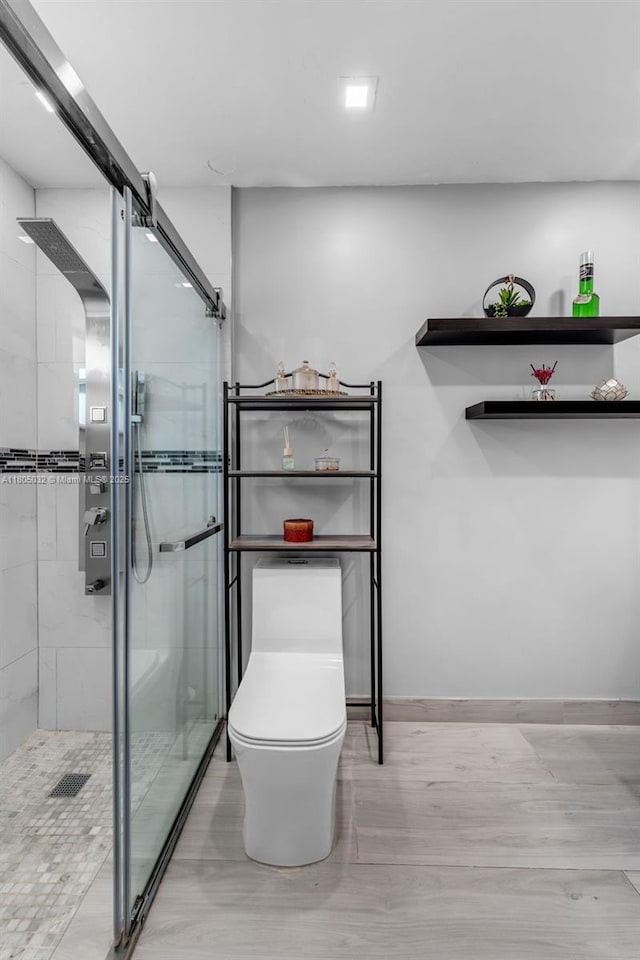 2023 SW 99th Ave, Miami, FL 33165 - full bath with a shower stall, toilet, wood finished floors, and baseboards