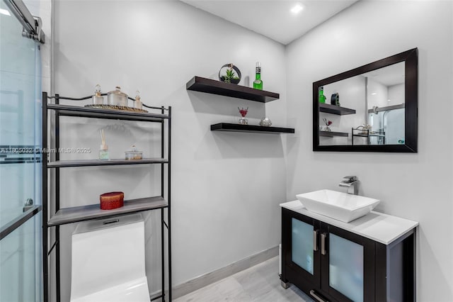 2023 SW 99th Ave, Miami, FL 33165 - full bath with vanity, baseboards, and wood finished floors