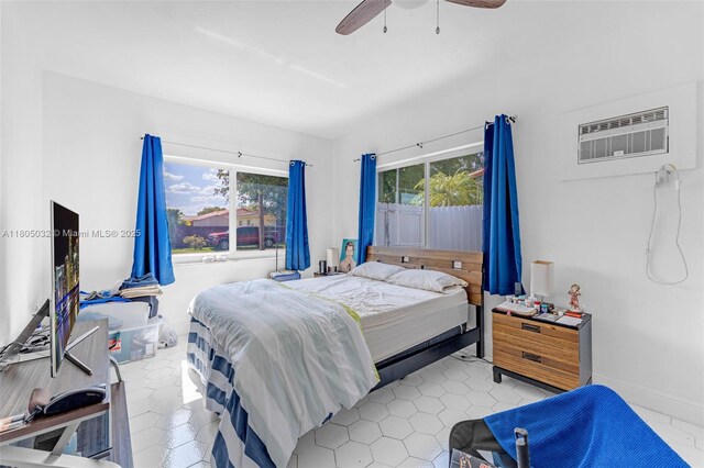 2023 SW 99th Ave, Miami, FL 33165 - bedroom featuring a wall mounted AC and a ceiling fan