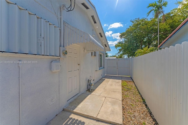 2023 SW 99th Ave, Miami, FL 33165 - view of side of home featuring fence and a patio