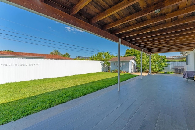 2023 SW 99th Ave, Miami, FL 33165 - view of patio with a shed and an outbuilding