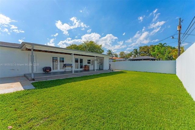 2023 SW 99th Ave, Miami, FL 33165 - view of yard with french doors and a patio