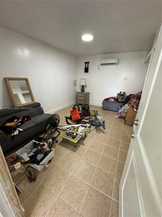 554 SW 7th St, Florida City, FL 33034 - recreation room featuring an AC wall unit and tile patterned flooring