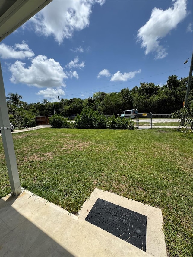 554 SW 7th St, Florida City, FL 33034 - view of green lawn featuring a patio