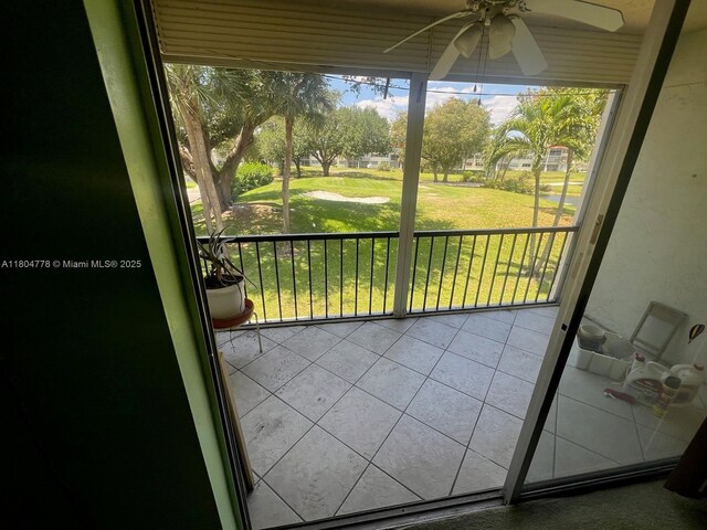 8930 S Hollybrook Blvd Unit 210, Pembroke Pines, FL 33025 - balcony with a ceiling fan and view of golf course