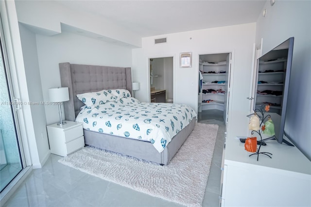 1900 N Bayshore Dr Unit 1918, Miami, FL 33132 - bedroom with connected bathroom, a spacious closet, and a closet