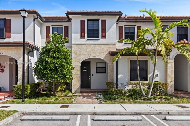 10611 W 33rd Ct, Hialeah, FL 33018 - multi unit property featuring uncovered parking, stucco siding, and stone siding