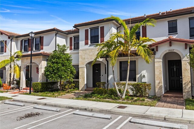10611 W 33rd Ct, Hialeah, FL 33018 - multi unit property with uncovered parking, stucco siding, and stone siding