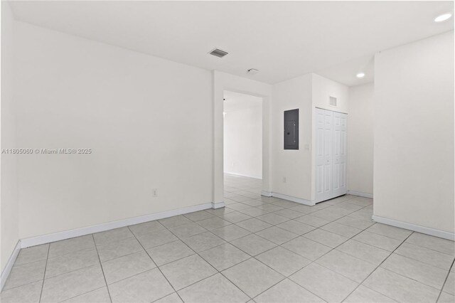 10611 W 33rd Ct, Hialeah, FL 33018 - unfurnished room with electric panel, recessed lighting, and light tile patterned flooring