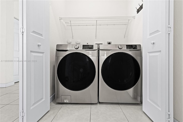 10611 W 33rd Ct, Hialeah, FL 33018 - washroom with washing machine and dryer and light tile patterned flooring