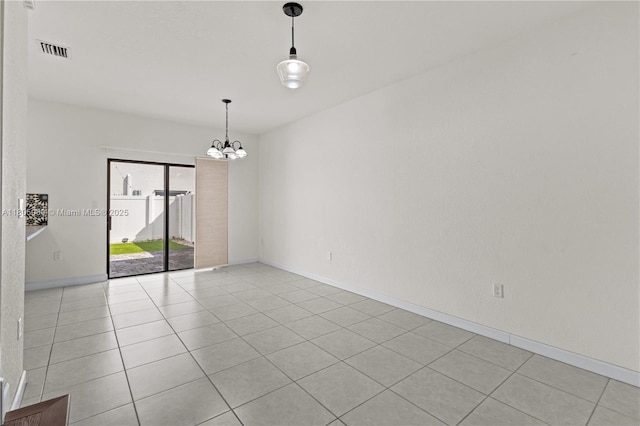 10611 W 33rd Ct, Hialeah, FL 33018 - spare room with a chandelier and light tile patterned flooring