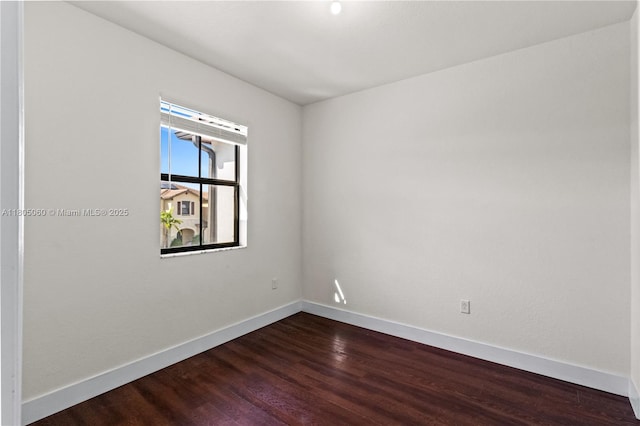 10611 W 33rd Ct, Hialeah, FL 33018 - unfurnished room featuring dark wood-style floors and baseboards