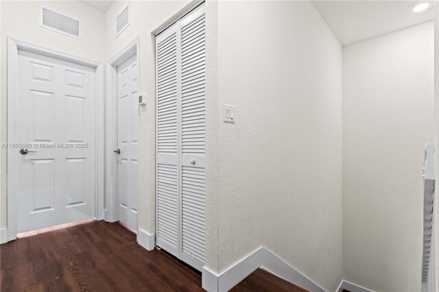 10611 W 33rd Ct, Hialeah, FL 33018 - corridor featuring dark wood-style flooring