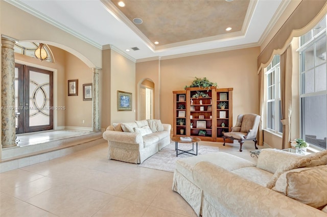 12668 NW 74th Pl, Parkland, FL 33076 - living room featuring arched walkways, ornate columns, a raised ceiling, ornamental molding, and light tile patterned floors