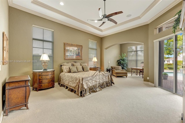 12668 NW 74th Pl, Parkland, FL 33076 - bedroom with crown molding, access to exterior, carpet, arched walkways, and a raised ceiling