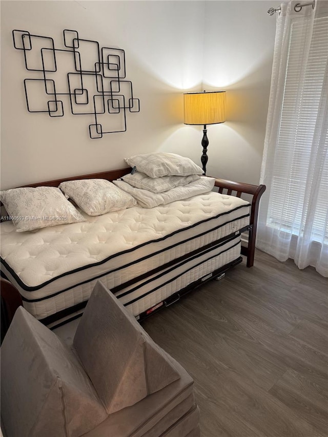bedroom featuring wood finished floors
