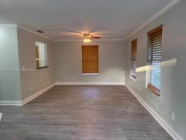 18761 SW 318th Ter, Homestead, FL 33030 - empty room featuring a ceiling fan, dark wood-style flooring, crown molding, and baseboards
