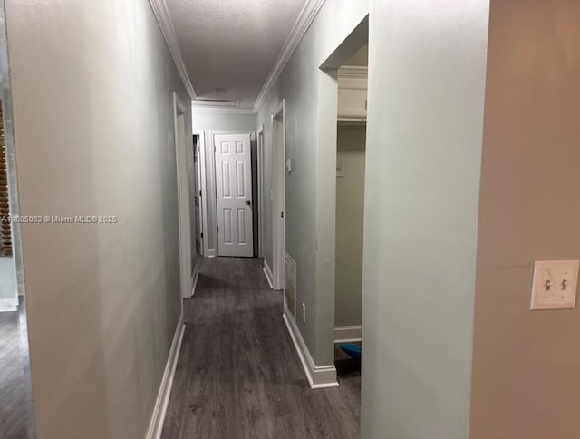 18761 SW 318th Ter, Homestead, FL 33030 - hallway featuring dark wood-style flooring, ornamental molding, baseboards, and attic access
