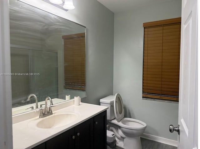 18761 SW 318th Ter, Homestead, FL 33030 - full bathroom featuring toilet, vanity, and wood finished floors