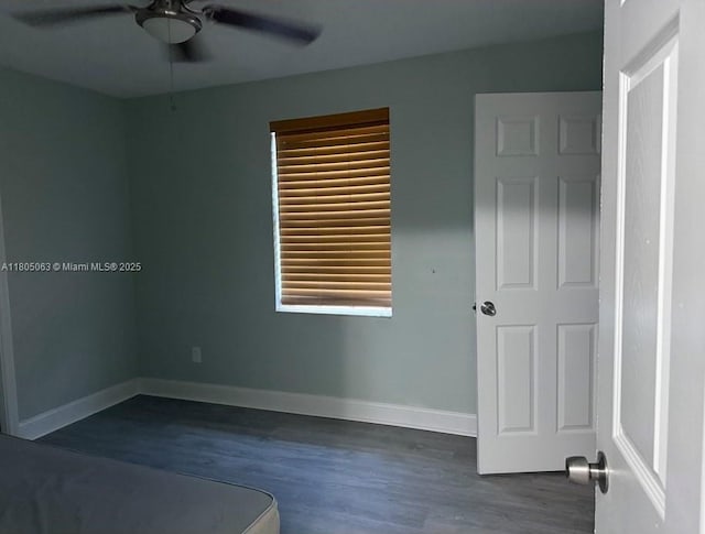 18761 SW 318th Ter, Homestead, FL 33030 - empty room featuring ceiling fan, dark wood-type flooring, and baseboards