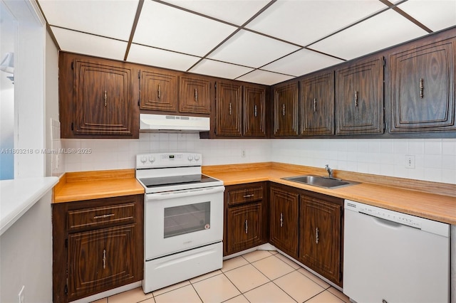 7081 Environ Blvd Unit 243, Lauderhill, FL 33319 - kitchen with white appliances, under cabinet range hood, a sink, light countertops, and tasteful backsplash