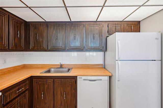 7081 Environ Blvd Unit 243, Lauderhill, FL 33319 - kitchen featuring white appliances, a sink, light countertops, and backsplash