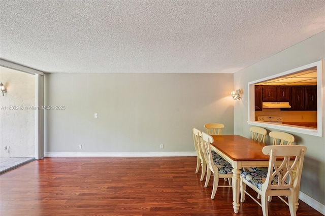 7081 Environ Blvd Unit 243, Lauderhill, FL 33319 - dining area with a textured ceiling, wood finished floors, and baseboards