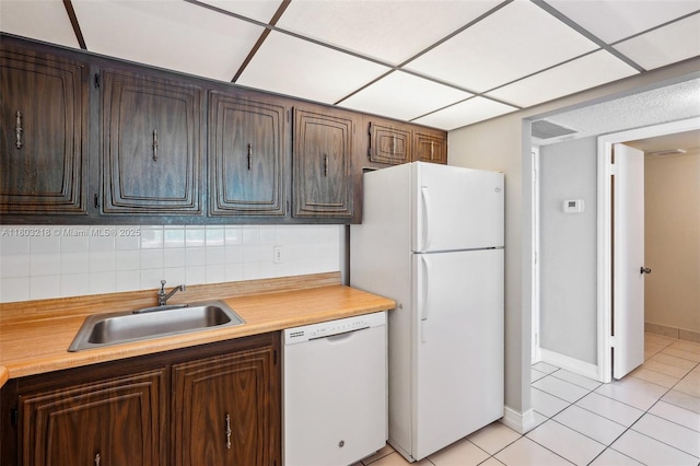 7081 Environ Blvd Unit 243, Lauderhill, FL 33319 - kitchen with white appliances, a sink, light countertops, light tile patterned flooring, and baseboards