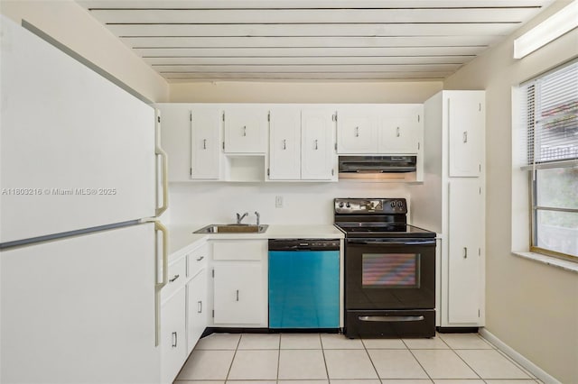 kitchen featuring black electric range, dishwashing machine, under cabinet range hood, a sink, and freestanding refrigerator